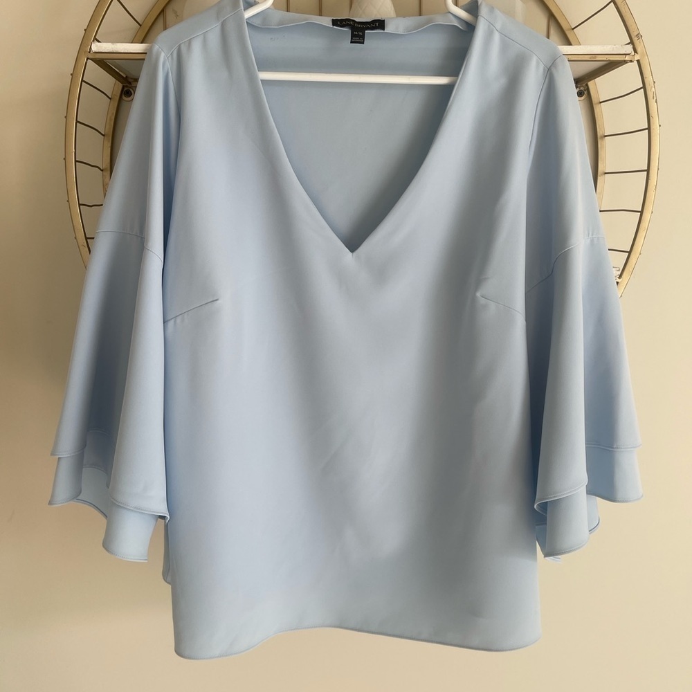 LANE Brytant baby blue top with fabulous degin especially in the sleeves.